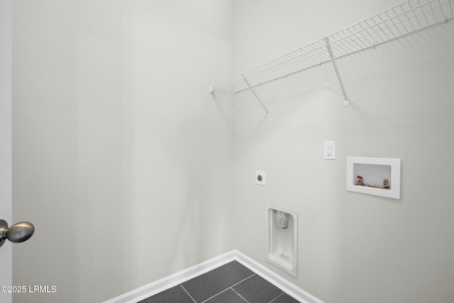 laundry room featuring electric dryer hookup, washer hookup, and tile patterned floors