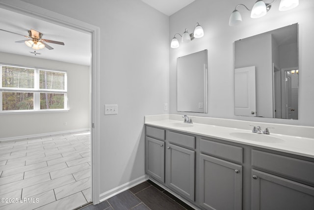 bathroom with ceiling fan and vanity