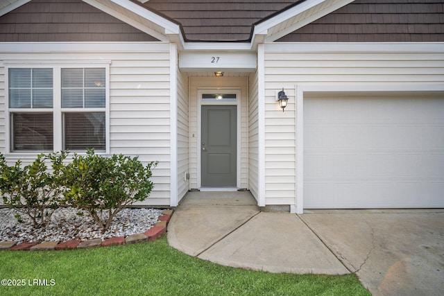 entrance to property featuring a garage