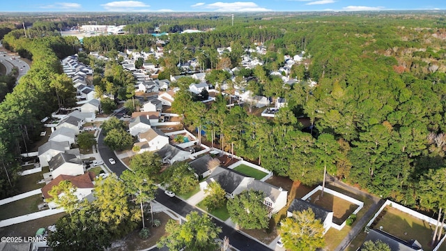 aerial view featuring a residential view and a view of trees