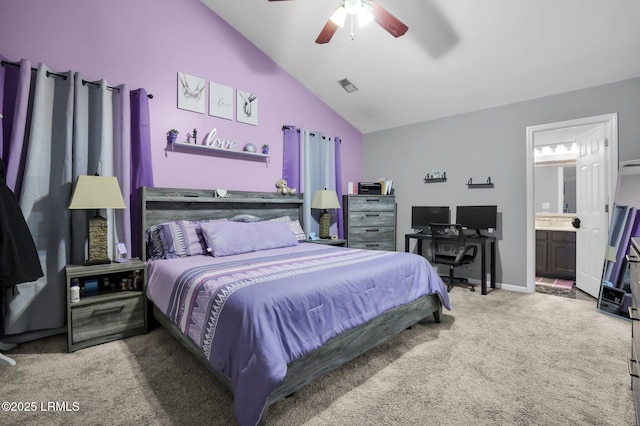 bedroom featuring visible vents, ceiling fan, ensuite bathroom, vaulted ceiling, and carpet flooring