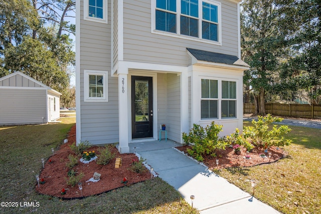 2960 Needlegrass Dr, Beaufort, SC 29902 - entrance to property with fence, a yard, and roof with shingles