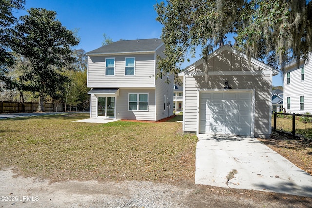 2960 Needlegrass Dr, Beaufort, SC 29902 - view of front facade featuring an outdoor structure, fence, a front yard, driveway, and a detached garage