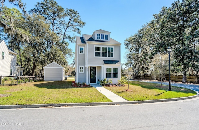 2960 Needlegrass Dr, Beaufort, SC 29902 - view of front facade with an outdoor structure, a storage unit, fence, and a front yard