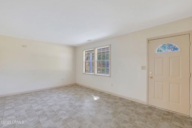 144 Middlefield Cir, Seabrook, SC 29940 - foyer entrance featuring plenty of natural light and baseboards