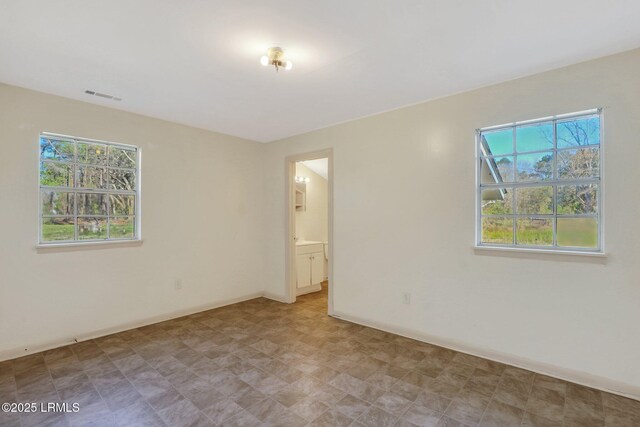 144 Middlefield Cir, Seabrook, SC 29940 - empty room with visible vents, baseboards, and a healthy amount of sunlight