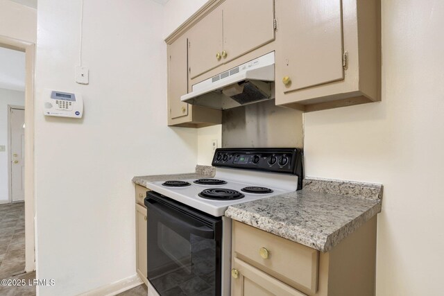 144 Middlefield Cir, Seabrook, SC 29940 - kitchen featuring light countertops, cream cabinets, under cabinet range hood, and electric range oven