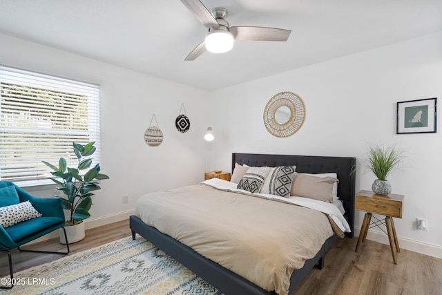 bedroom featuring ceiling fan and hardwood / wood-style floors