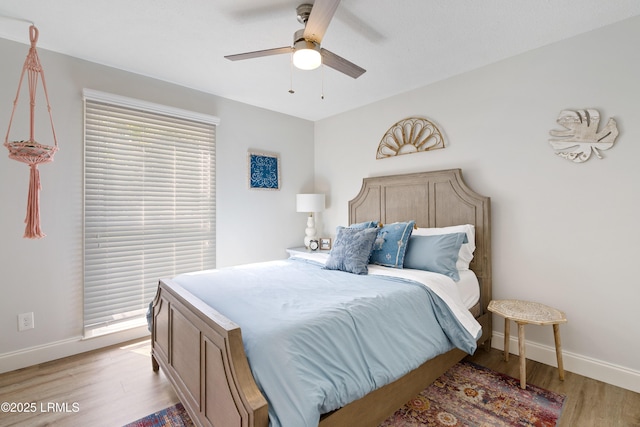 bedroom featuring ceiling fan and light hardwood / wood-style flooring