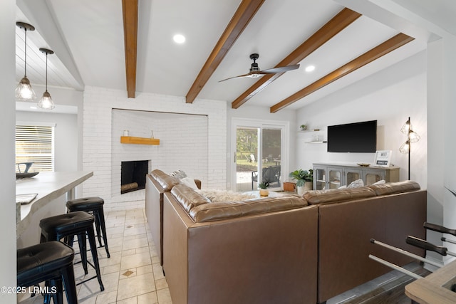 tiled living room with ceiling fan, a fireplace, and lofted ceiling with beams