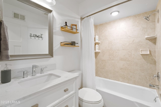 full bathroom with shower / bath combo, vanity, and toilet