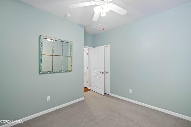 carpeted empty room with ceiling fan