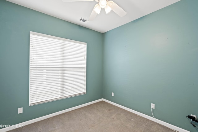 unfurnished room featuring carpet and ceiling fan