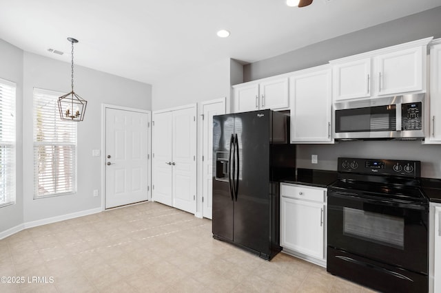 kitchen with pendant lighting, white cabinets, and black appliances