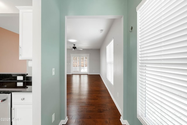 hall with dark wood-type flooring