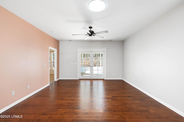 spare room featuring dark hardwood / wood-style flooring, french doors, and ceiling fan