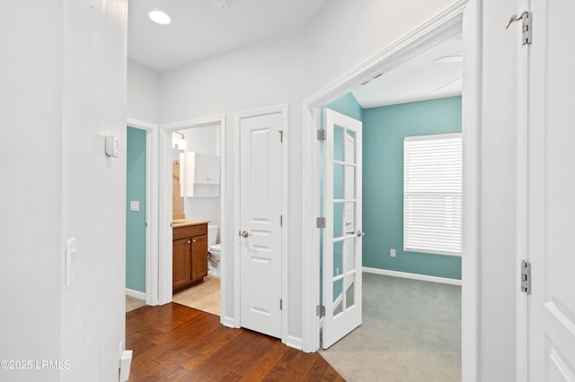 hall with dark hardwood / wood-style flooring