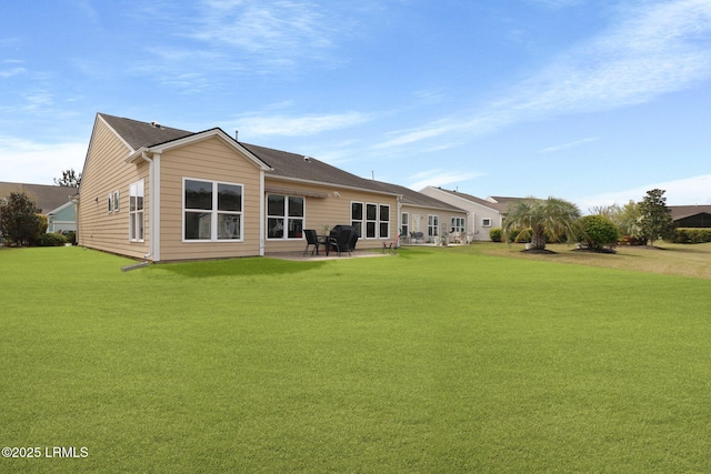 198 Knollwood Ct, Okatie, SC 29909 - rear view of property with a lawn and a patio area