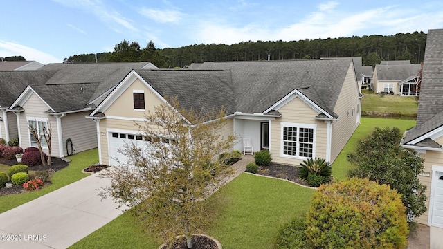 198 Knollwood Ct, Okatie, SC 29909 - view of front facade with concrete driveway, a front lawn, and roof with shingles
