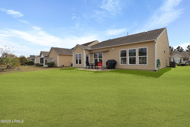 198 Knollwood Ct, Okatie, SC 29909 - rear view of property featuring a yard, a patio, and central AC