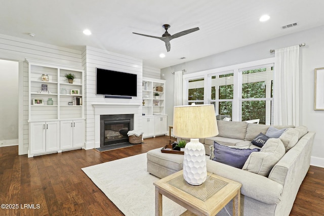 397 Hampton Lake Dr, Bluffton, SC 29910 - living area with ceiling fan, dark wood-style flooring, a large fireplace, recessed lighting, and baseboards