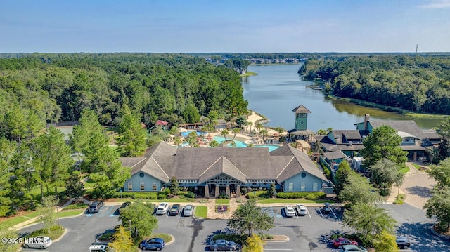 397 Hampton Lake Dr, Bluffton, SC 29910 - aerial view of a nearby body of water, a forest, and a pool area