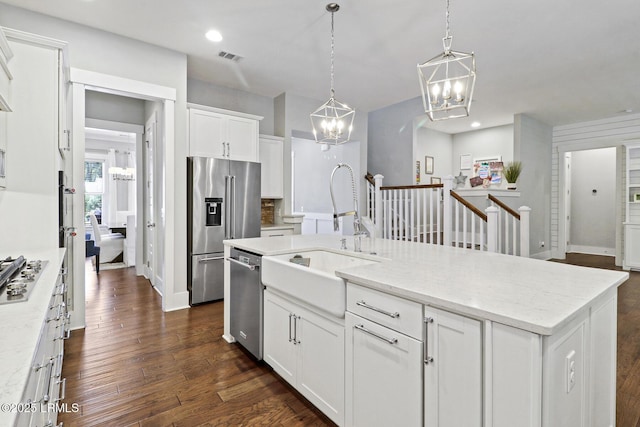 397 Hampton Lake Dr, Bluffton, SC 29910 - kitchen with appliances with stainless steel finishes, a chandelier, a sink, white cabinets, and dark wood-type flooring