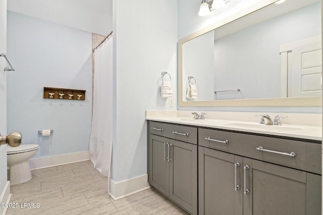 397 Hampton Lake Dr, Bluffton, SC 29910 - bathroom featuring toilet, baseboards, double vanity, wood finished floors, and a shower with shower curtain