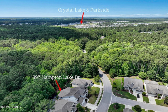 397 Hampton Lake Dr, Bluffton, SC 29910 - aerial view of property and surrounding area with a heavily wooded area and nearby suburban area