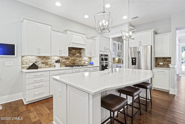 397 Hampton Lake Dr, Bluffton, SC 29910 - kitchen with a chandelier, decorative backsplash, a center island with sink, white cabinetry, and recessed lighting