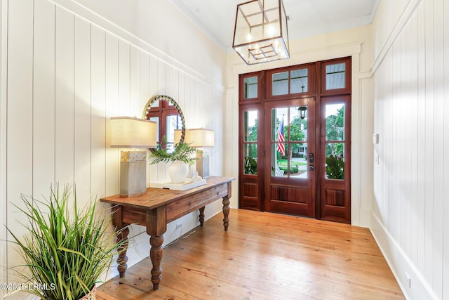 24 Carrier Blf, Bluffton, SC 29909 - foyer entrance featuring a chandelier, light wood-style floors, and ornamental molding