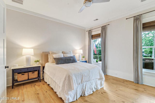 24 Carrier Blf, Bluffton, SC 29909 - bedroom featuring light wood-type flooring, multiple windows, and a ceiling fan