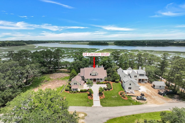 24 Carrier Blf, Bluffton, SC 29909 - aerial view of property and surrounding area with a nearby body of water and a tree filled landscape