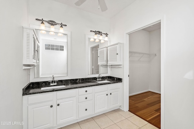 bathroom with vanity, tile patterned flooring, and ceiling fan