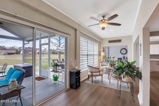 sunroom / solarium with ceiling fan