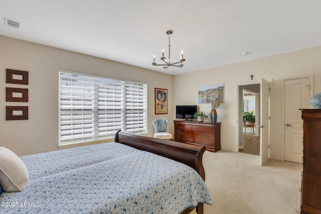 bedroom with light carpet, visible vents, and an inviting chandelier