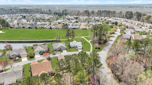 aerial view with a residential view and a water view