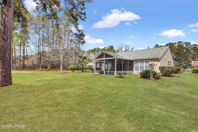 view of yard featuring a sunroom