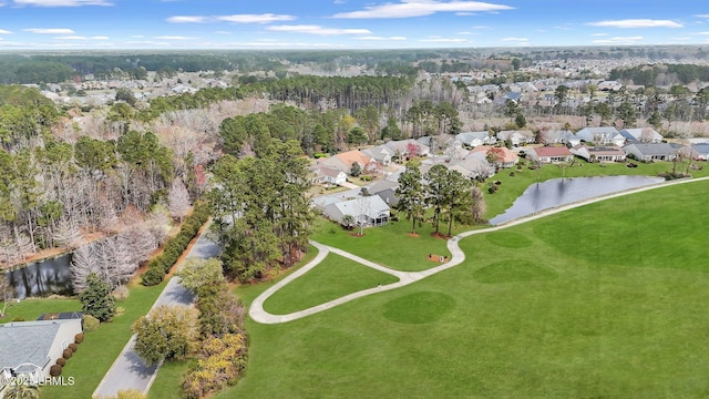 drone / aerial view featuring a residential view and a water view