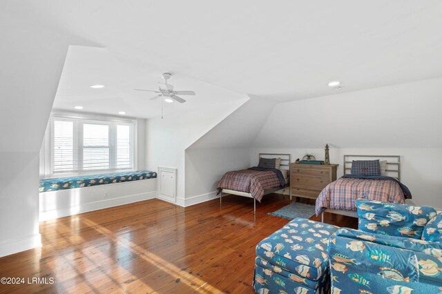 bedroom with wood-type flooring, ceiling fan, and vaulted ceiling