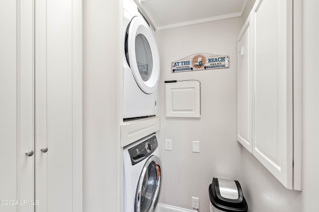 laundry area featuring stacked washer / dryer