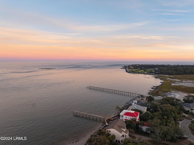 aerial view at dusk with a water view