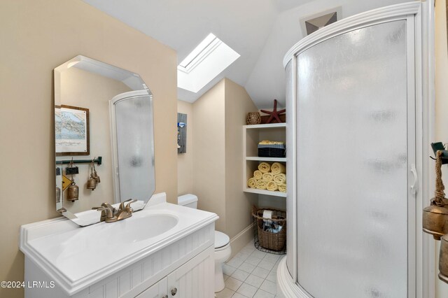 bathroom with tile patterned flooring, a shower with door, lofted ceiling with skylight, and toilet