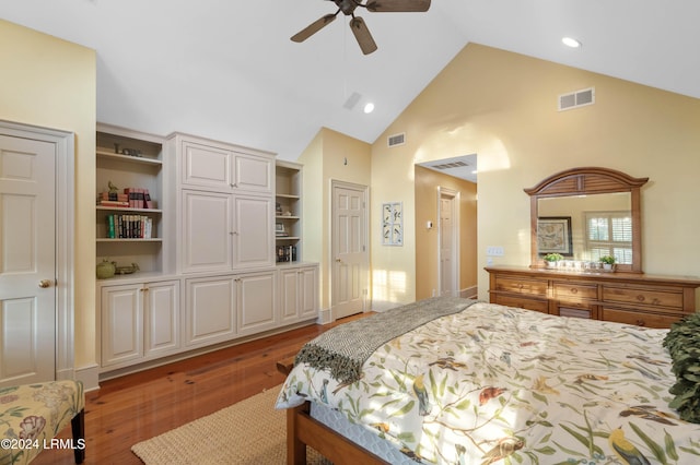 bedroom with hardwood / wood-style flooring, ceiling fan, and high vaulted ceiling