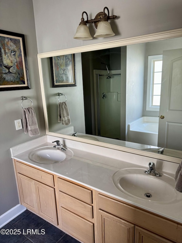 full bath featuring tile patterned flooring, a shower stall, a garden tub, and a sink