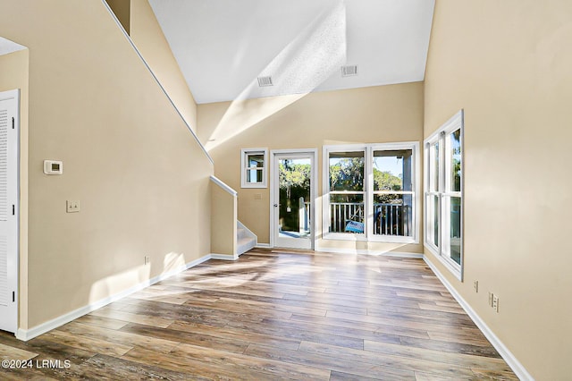 entryway featuring visible vents, stairs, baseboards, and hardwood / wood-style floors