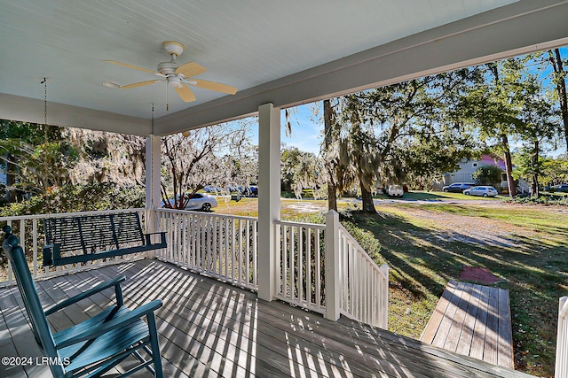 deck with a porch and a ceiling fan