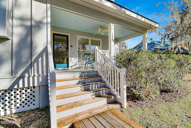 doorway to property featuring ceiling fan and covered porch