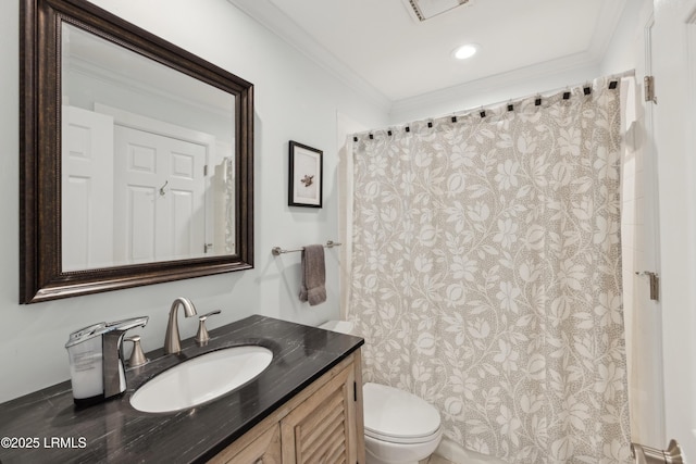 bathroom featuring crown molding, vanity, and toilet