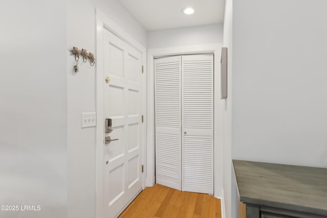 entryway with hardwood / wood-style flooring